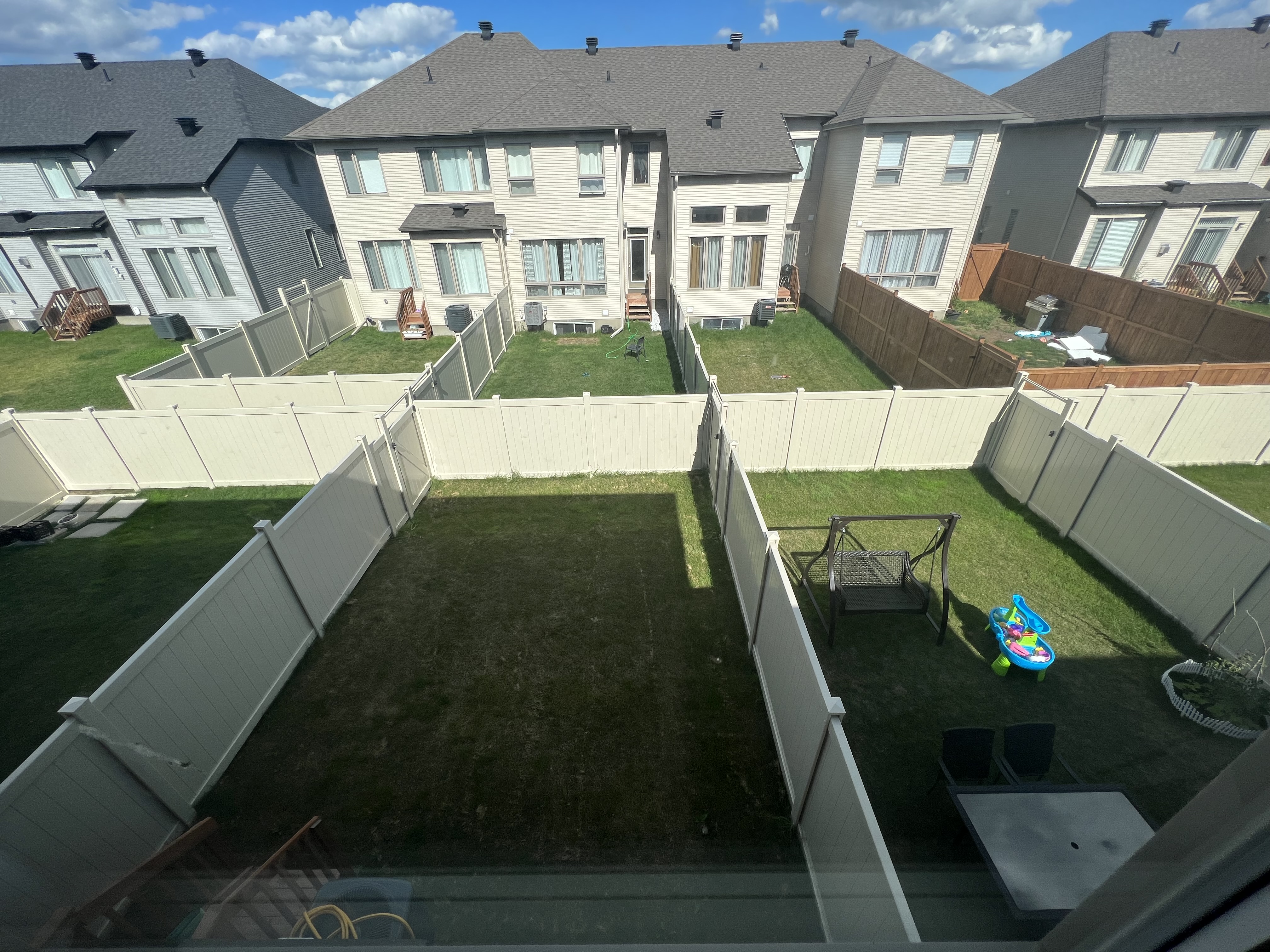White PVC privacy fence installation in Ottawa
